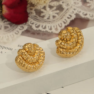 Textured shell stud earrings in gold with a hammered finish.