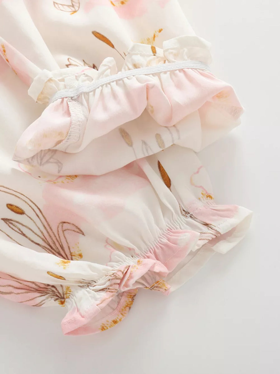Baby bottoms with pink floral and bunny print, ruffled elastic cuffs, cotton fabric.