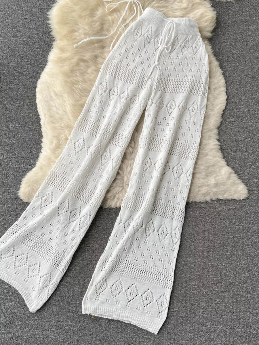 White crochet wide-leg pants with diamond pattern and drawstring waist.