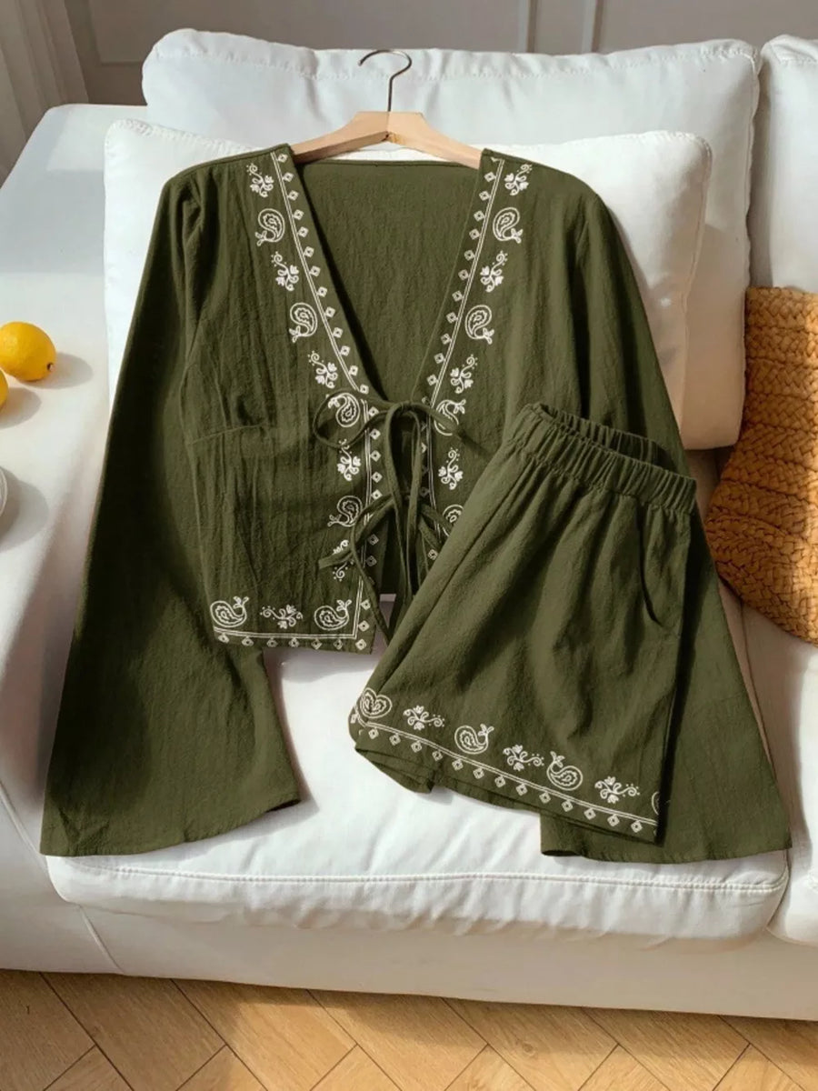 Army green cotton tie-front top with white embroidery and matching shorts.