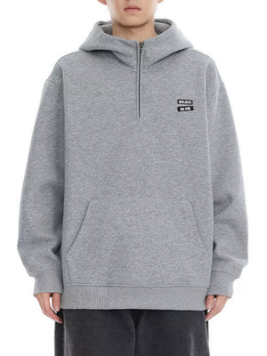 Plus-size grey quarter-zip hoodie with chest graphic and kangaroo pocket.
