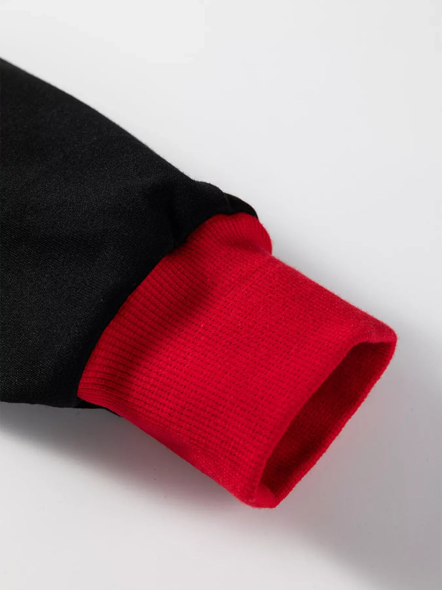 Black sweatshirt with red ribbed cuff detail