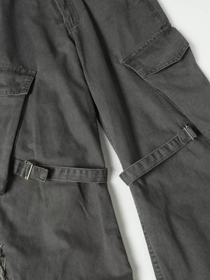 Grey cargo pants with buckle detail, multiple pockets, and distressed accents.