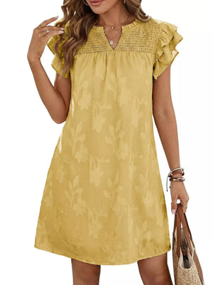 Apricot floral embossed mini dress with smocked bodice and ruffled sleeves.