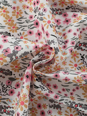 Toddler cotton dress with pink and yellow floral print and ruffle sleeves.