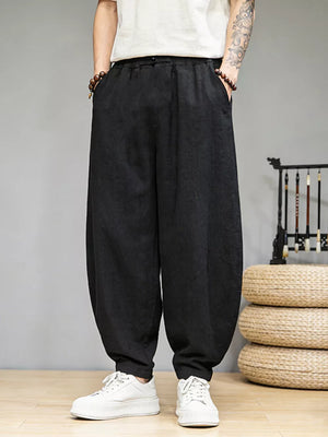 Black relaxed fit sweatpants for men with pockets and a drawstring waist.