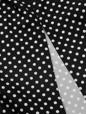 Black polka dot maxi dress with a slit detail