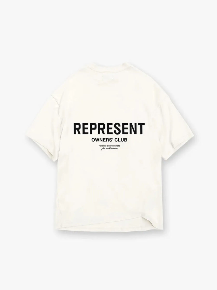 Oversized ivory graphic tee with black "REPRESENT OWNERS' CLUB" text and smaller print.