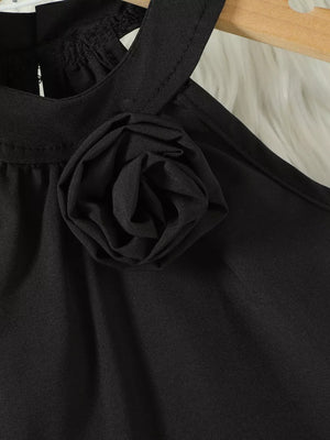 Black toddler top with halter neck and fabric rose applique detail.