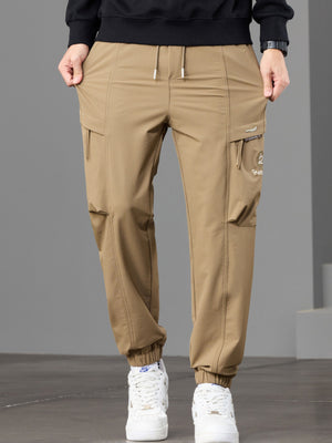 95%polyester,5%spandex Care instructions: Machine wash cold joggers in Green with tapered silhouette
