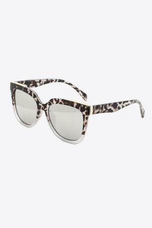 Leopard print angular frame sunglasses with silver lenses and gold accents.