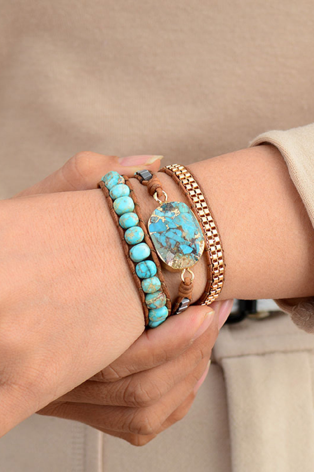 Turquoise and copper wrap bracelet set with beaded and stone details on wrist