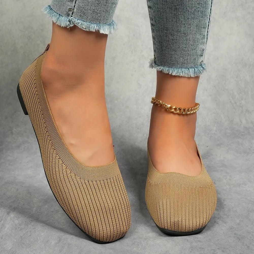 Beige knit square toe flats with a ribbed texture and a gold chain anklet.