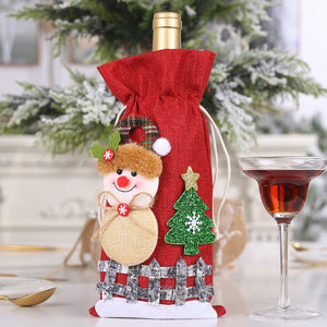 Red wine bottle gift bag with snowman, Christmas tree, and fence design.