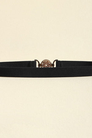 Black elastic belt with a round medallion buckle and alloy details