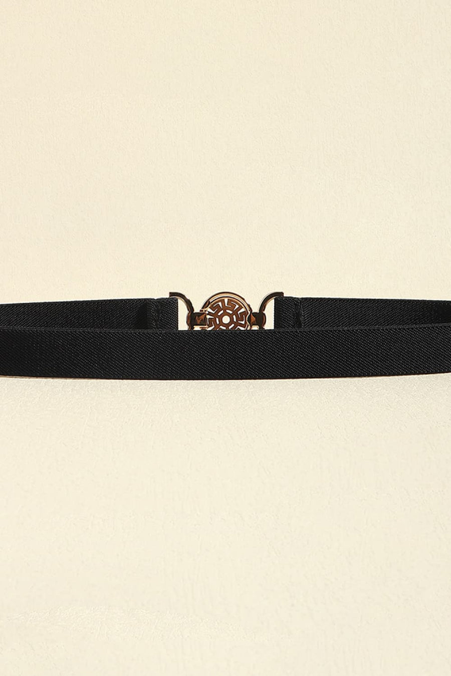 Black elastic belt with a round medallion buckle and alloy details