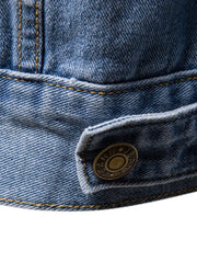 Light wash denim trucker jacket with button detail and classic fit.