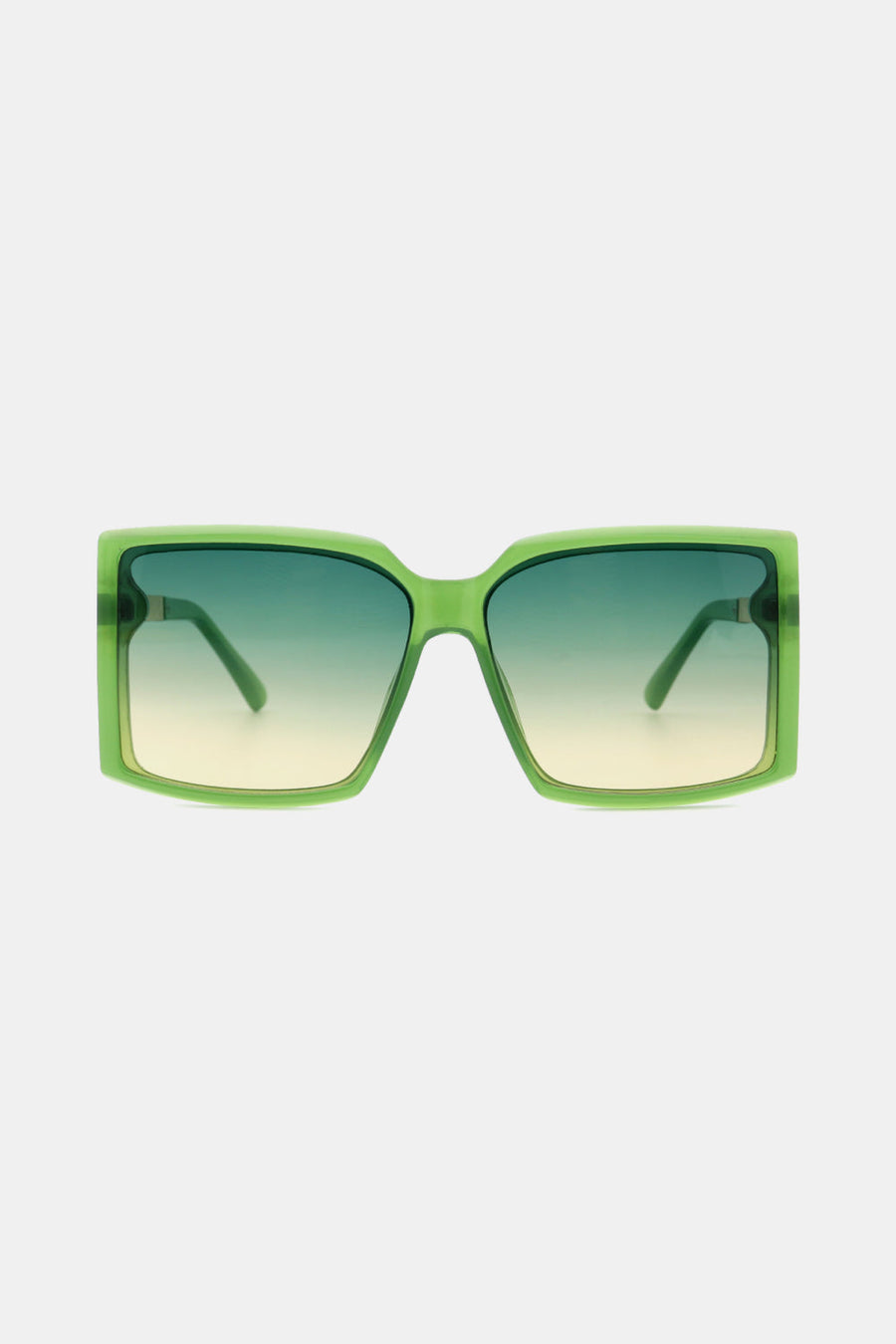 Green geometric sunglasses with gradient lenses and bold frames.