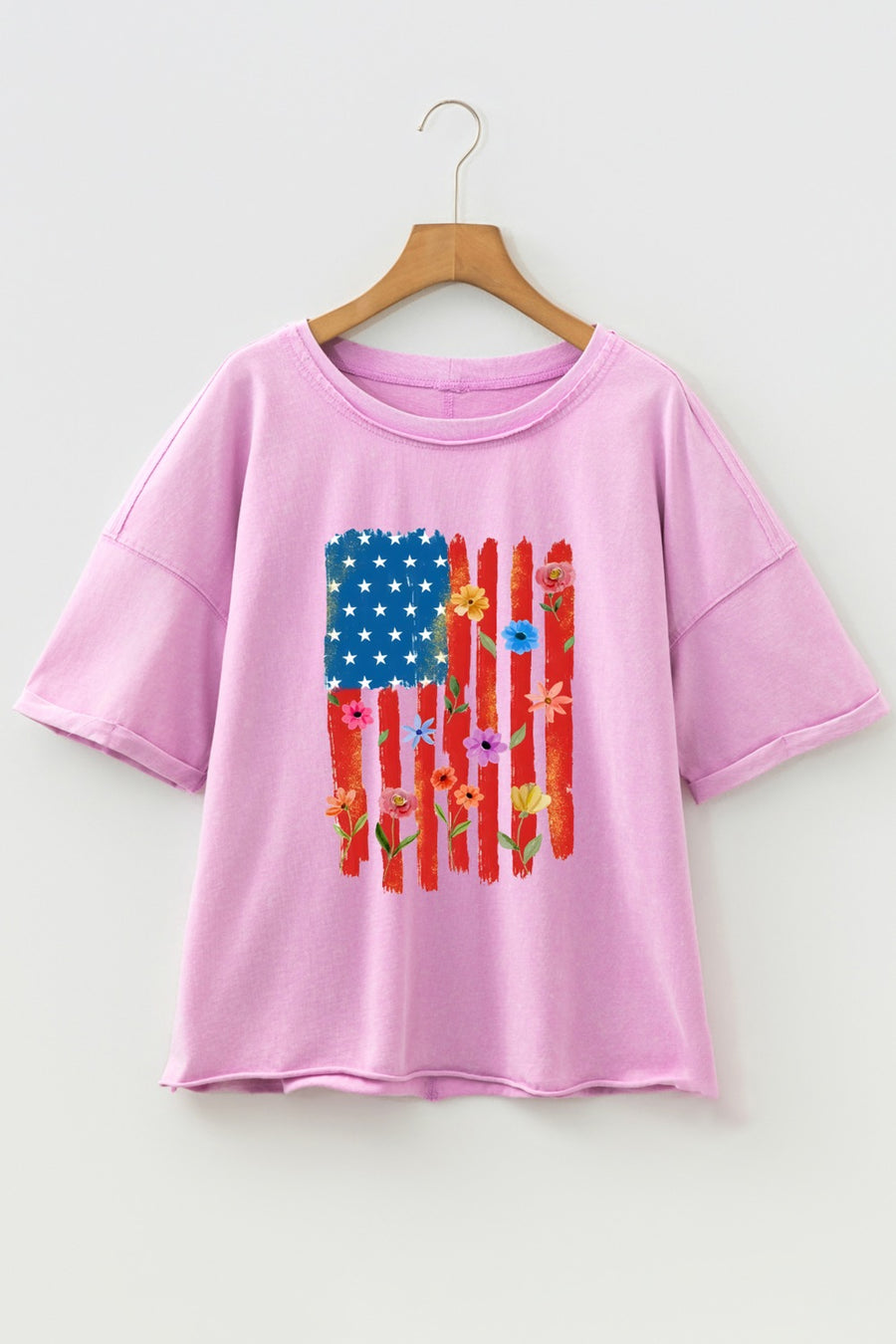 Pink cotton crew neck t-shirt with a floral American flag graphic.