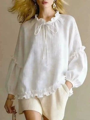 blouse in white featuring tied and relaxed fit
