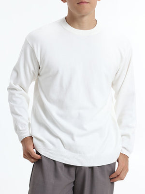 White crewneck sweater with ribbed hem and long sleeve