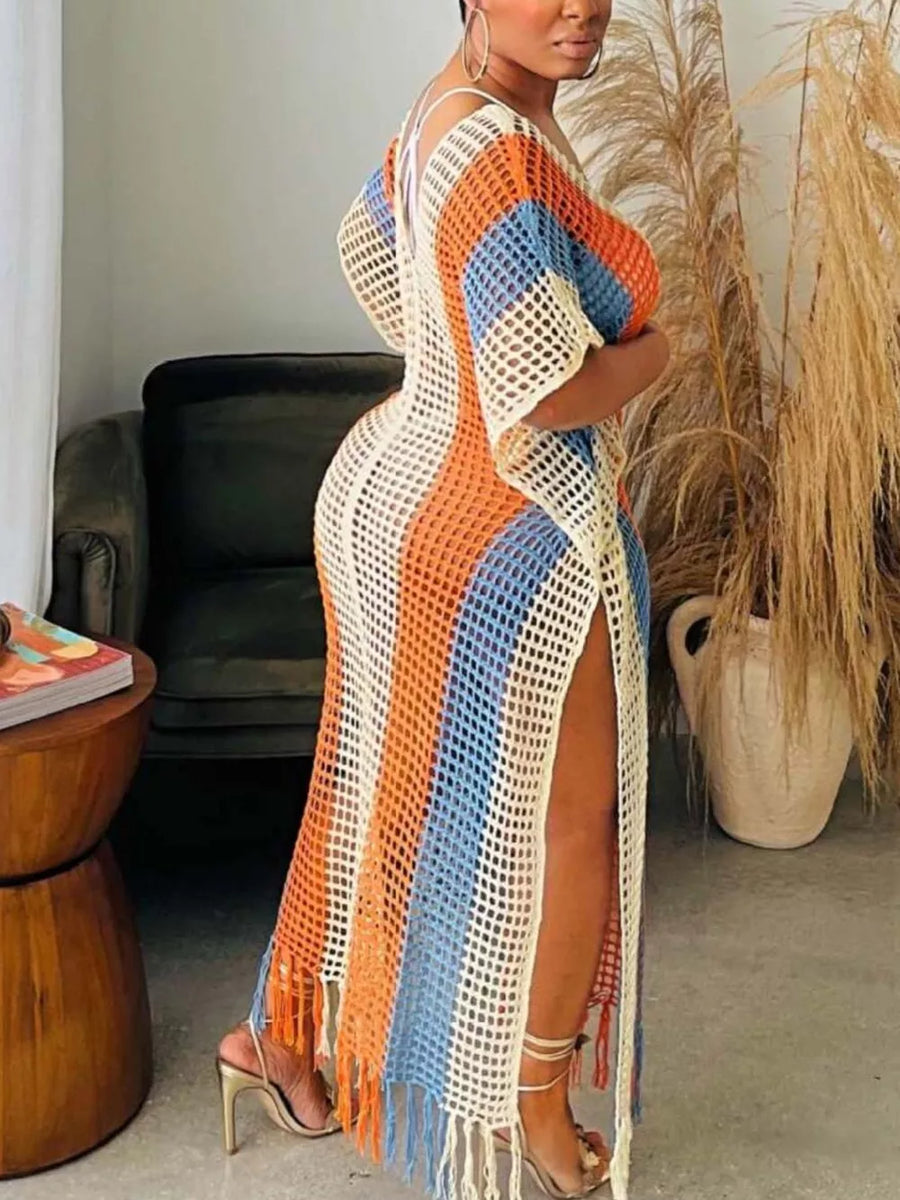 Vibrant striped crochet cover-up dress with fringe hem and high slits.