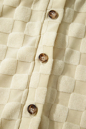 Textured cream checkered romper with button front detail