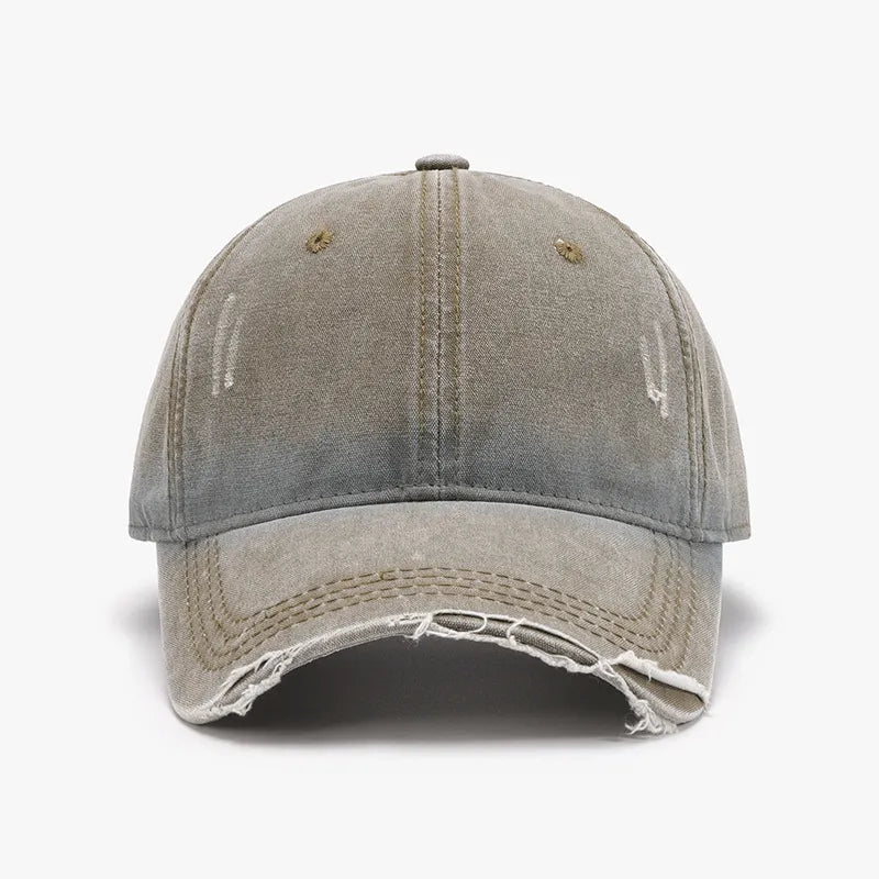 Faded denim baseball cap with distressed details and frayed brim