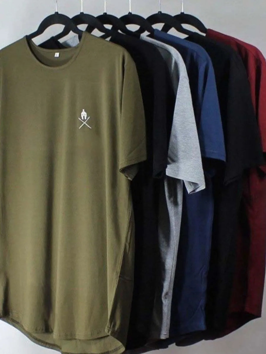 Olive green t-shirt with small white logo on chest, hanging with other colors.