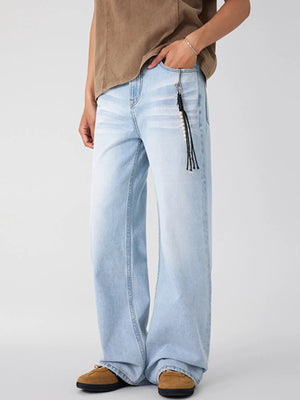 Men's Glacier Blue washed wide-leg jeans with a beaded keychain detail.