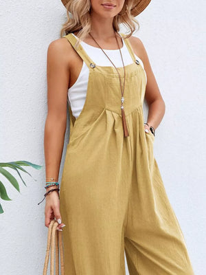 Light Yellow wide-leg romper with adjustable straps, button details, and pockets, styled with a white tank top.