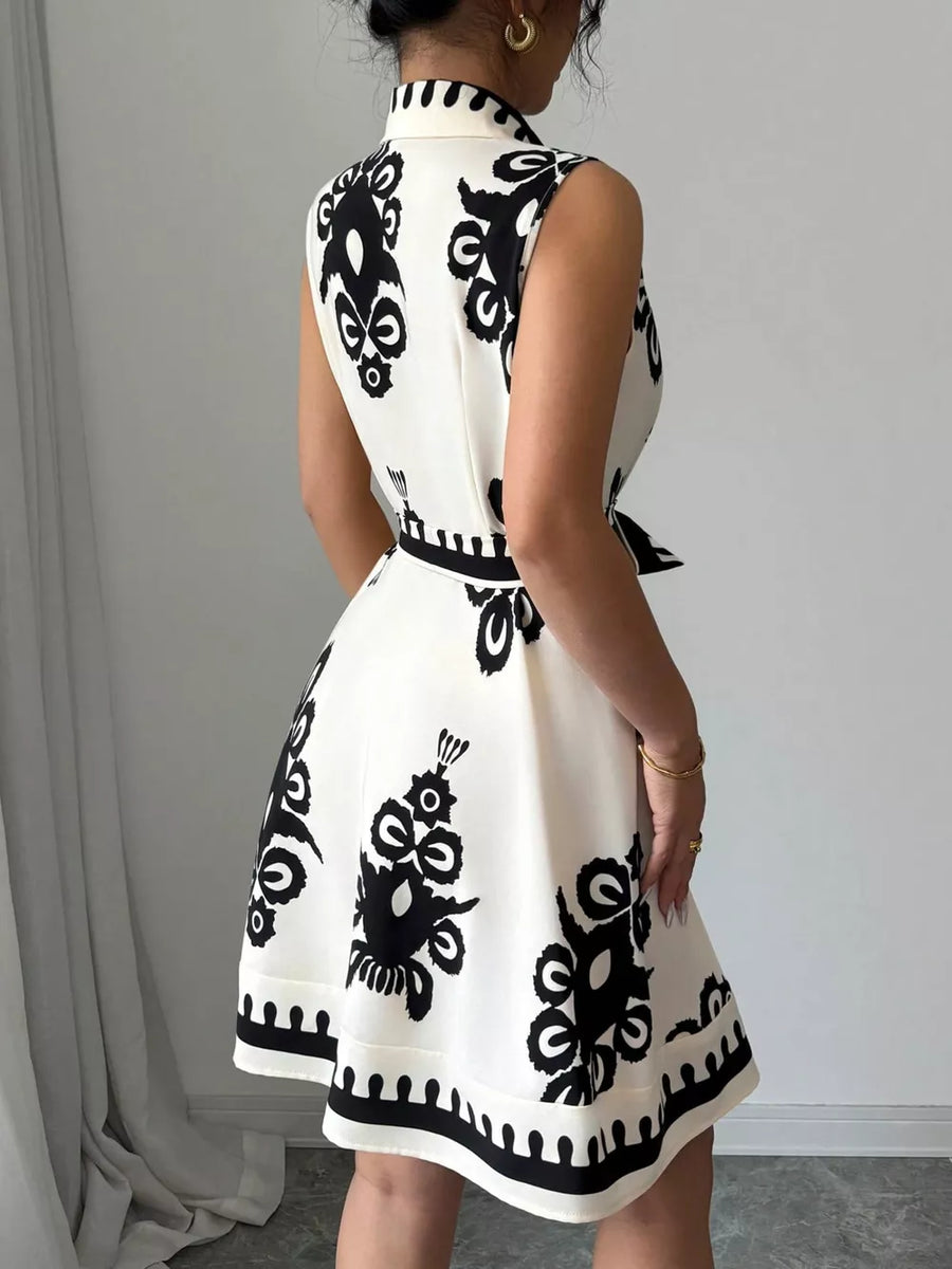 White sleeveless dress with black abstract print and tie waist