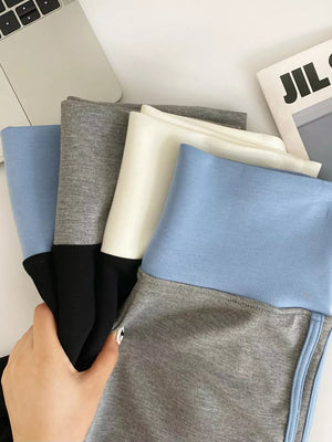 Light blue and gray athletic jogger shorts with contrast trim and black accents.
