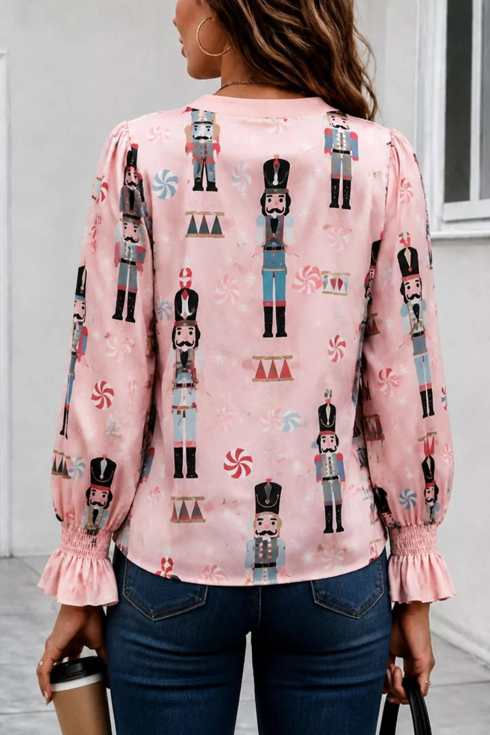 light blue blouse featuring ruffled and nutcracker print