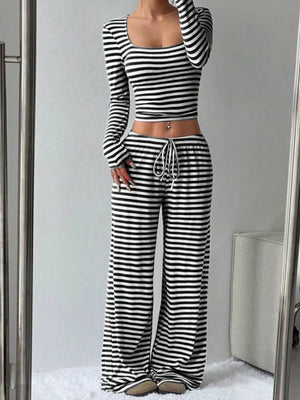 Black and white striped crop top and wide-leg pants with drawstring waist.