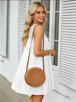 White tiered dress with lace yoke and crochet trim, sleeveless, relaxed fit