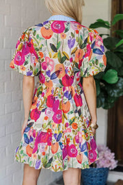 Cotton tiered mini dress with bold floral print, puff sleeves, and a striped collar.
