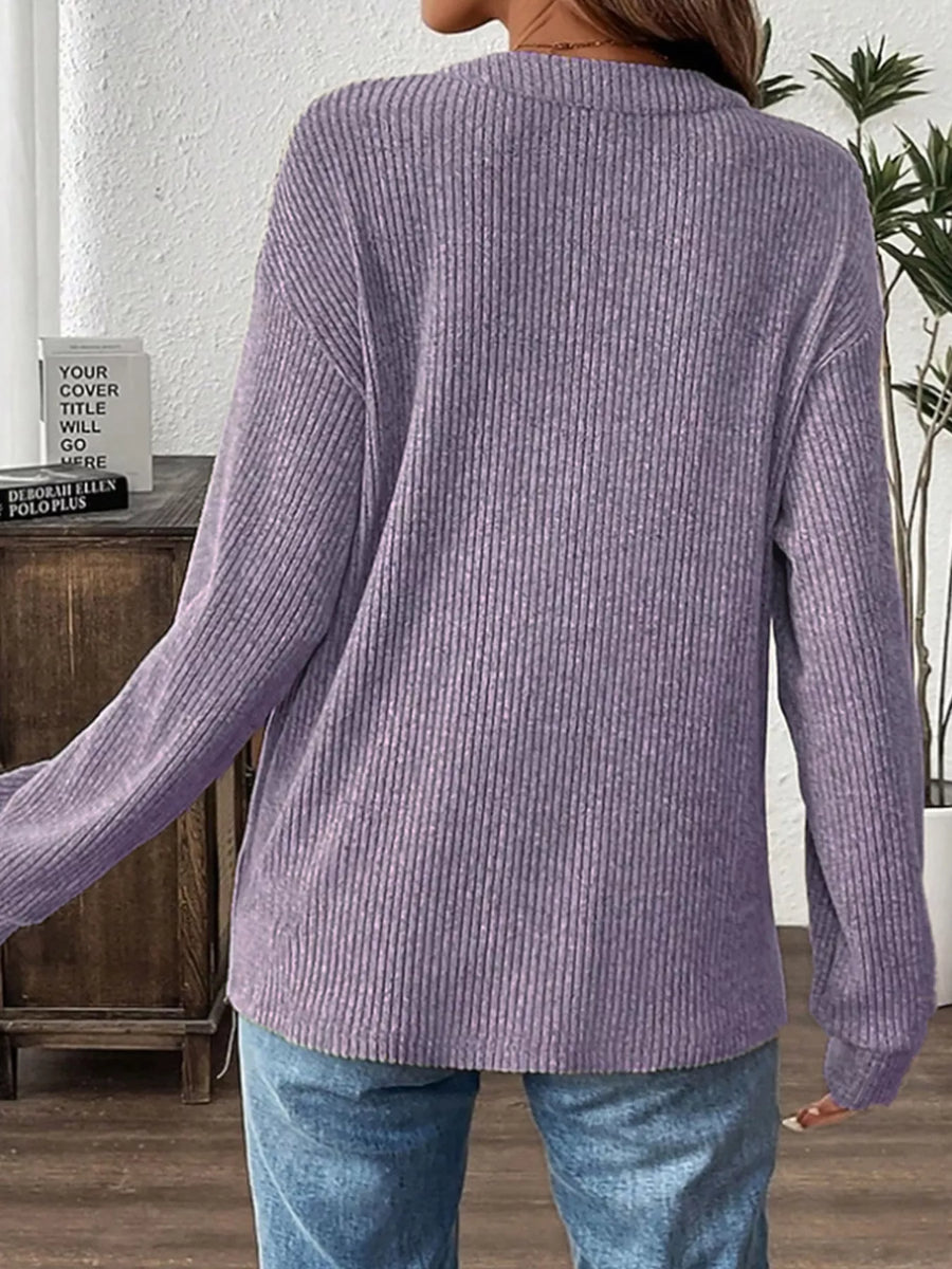 Lavender ribbed long-sleeve top with button detail.