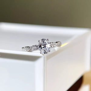ring in silver featuring oval cut diamond and fitted fit