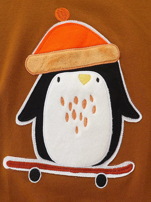 Toddler sweatshirt with brown cotton, featuring a cute penguin appliqué wearing an orange beanie and riding a skateboard.