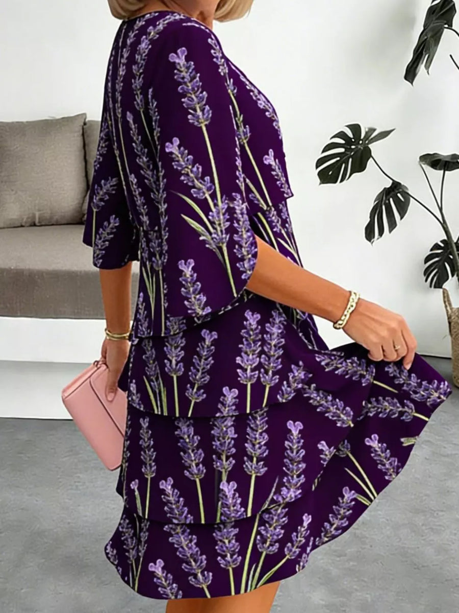 Purple floral tiered ruffle hem dress with short sleeves and above-knee length.