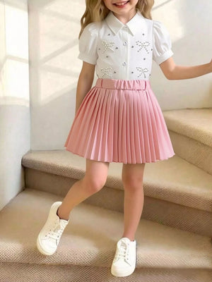 Girls' pink pleated skirt and white bow-embellished puff-sleeve top duo