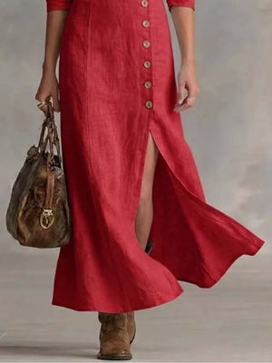 Red button-down maxi dress with V-neck and high slit, styled with a bag.