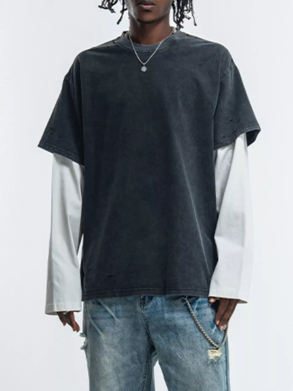 Men's black distressed fake two-piece long sleeve t-shirt with white undersleeve.