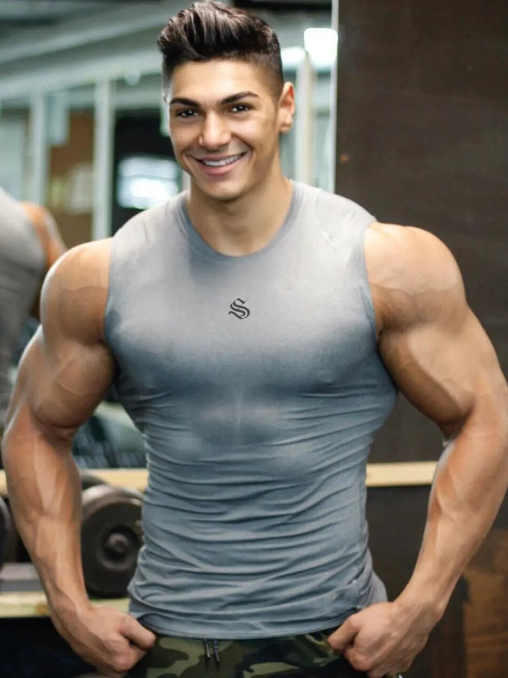 Performance Fit Muscle Tank in gray with a crew neck and logo detail.