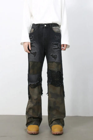 Distressed dark camo panel flare jeans with ripped details.