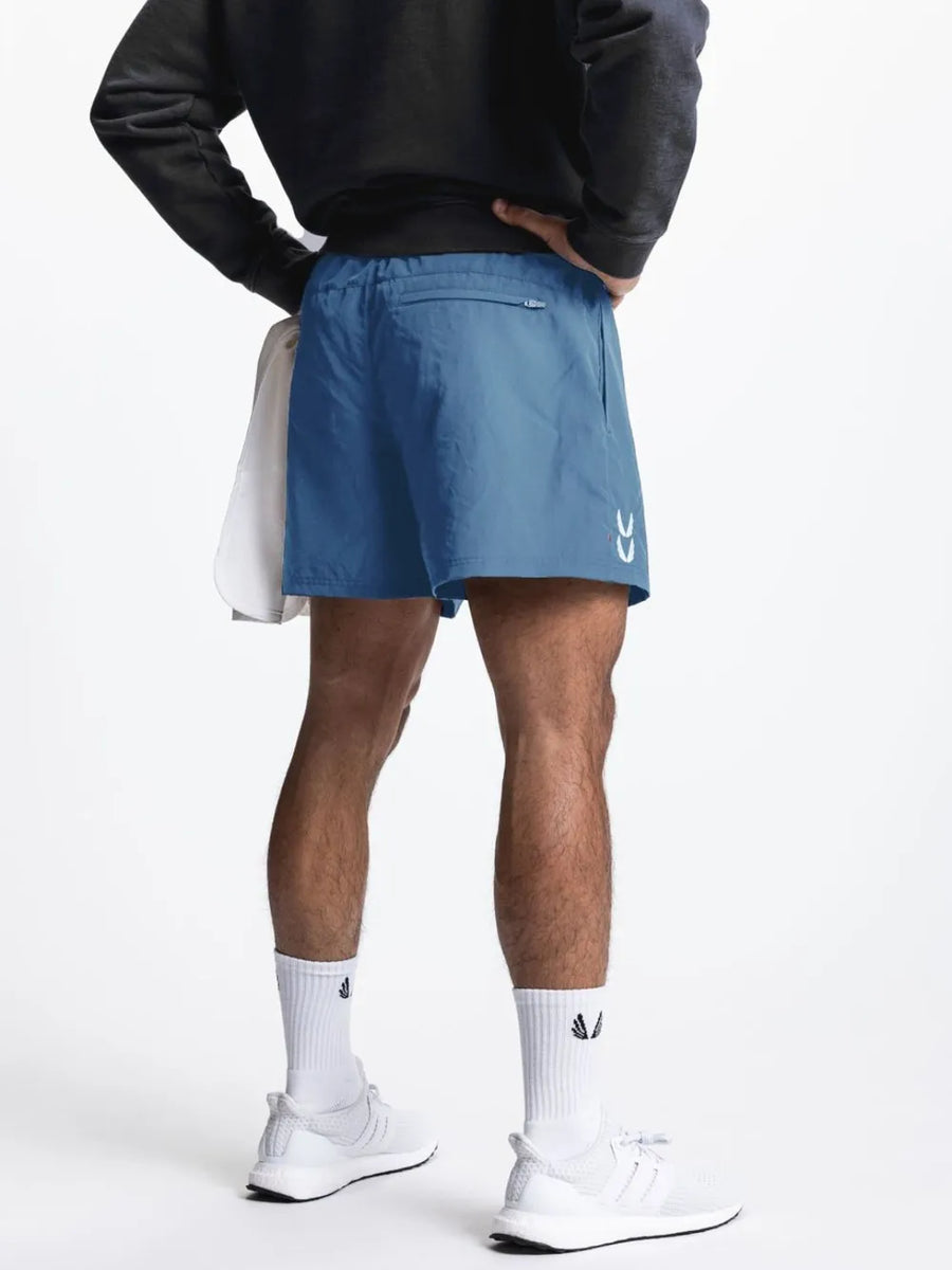 Performance drawcord sport shorts in Sky Blue with white logo detail and zip pocket.