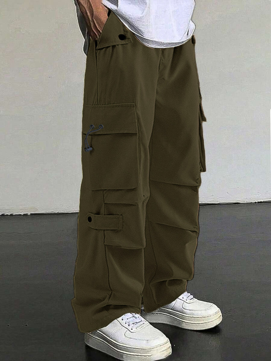 Olive green cargo pants with multiple pockets and drawstring detail.