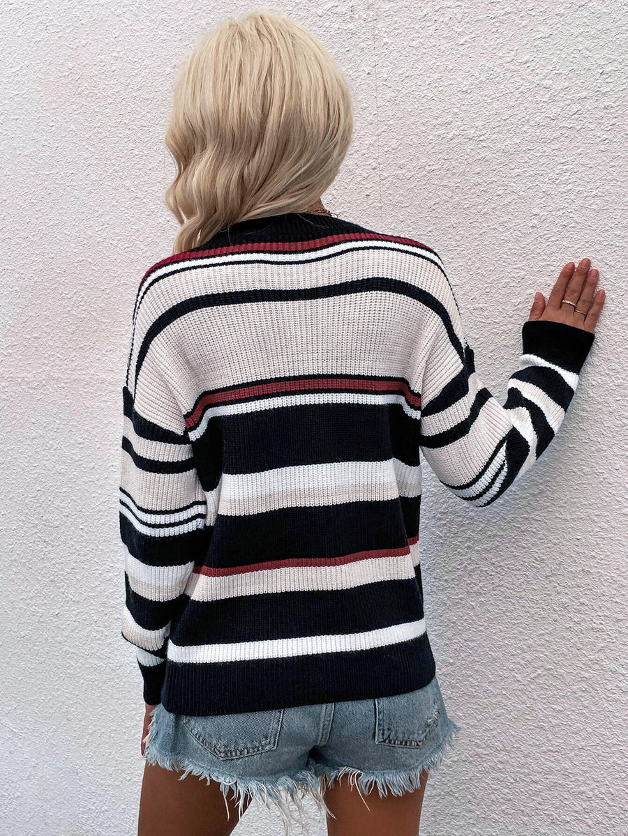 Pastel stripe crewneck knit sweater with black, white, beige, and red stripes.