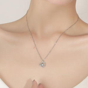 opalescent white necklace featuring pendant and floral